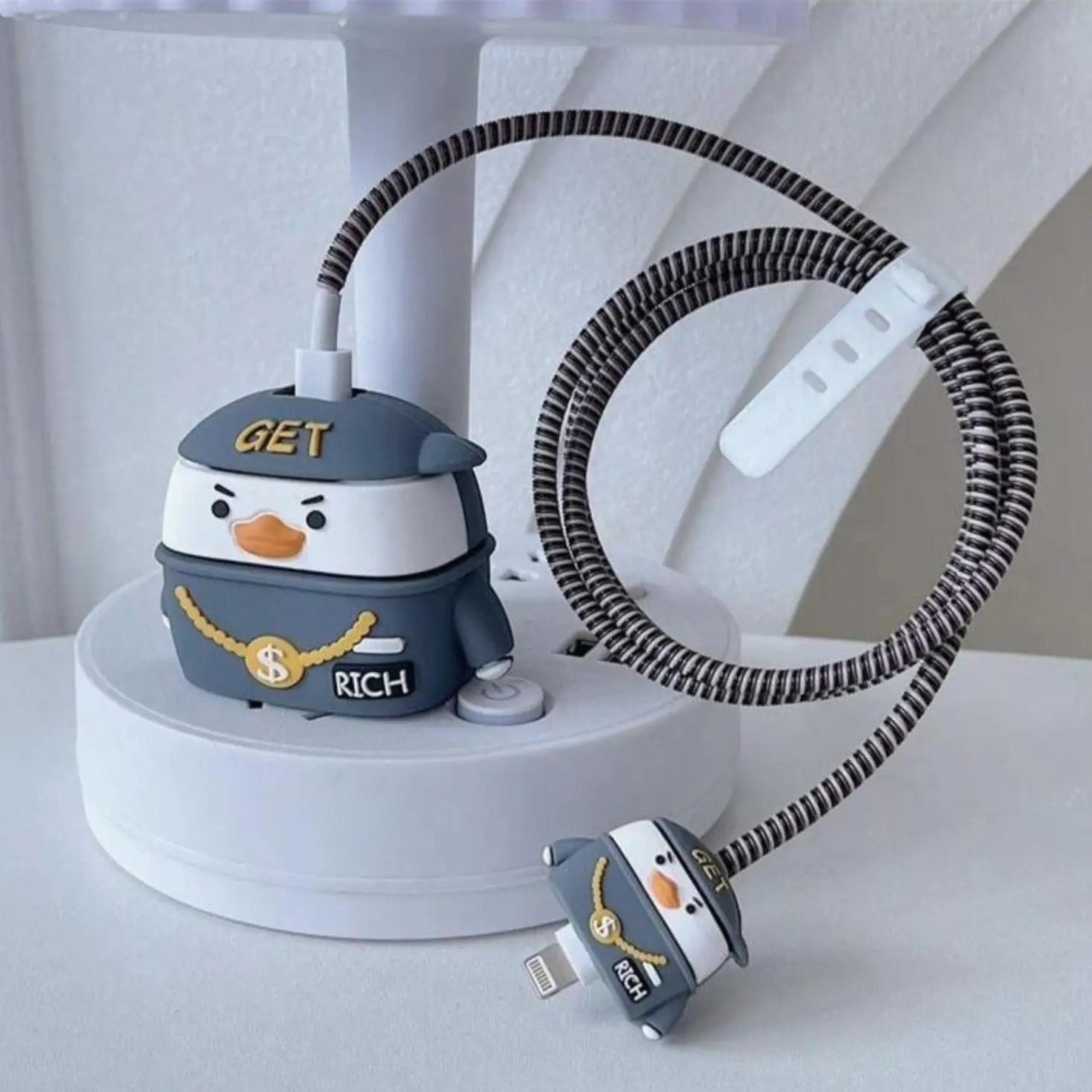 Rich duck charger cover on display stand with cable winder