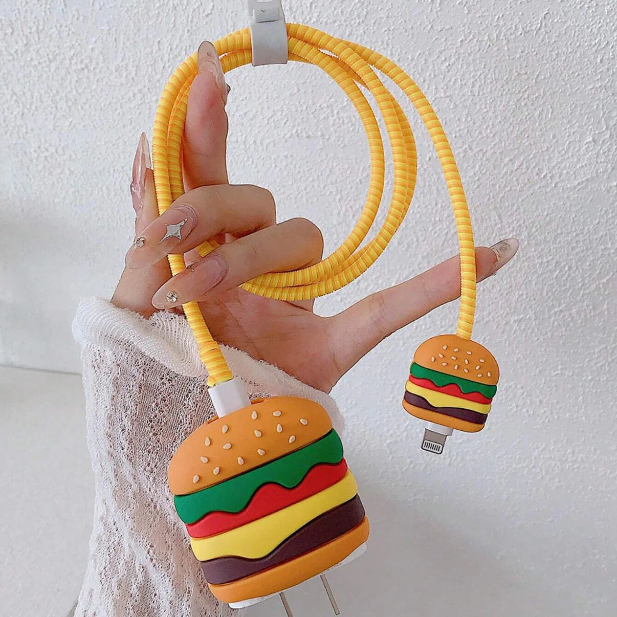 Burger charger cover set displayed in white bowl with yellow cable winder and mini burger cable protector