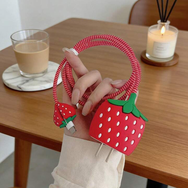 Strawberry Charger Cover with Red Coil Cable Winder held in hand – iPouch