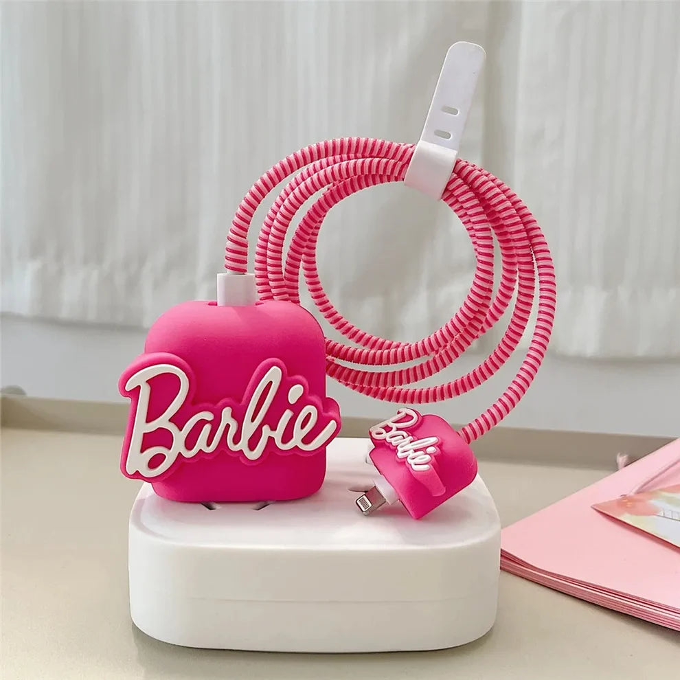 Hot pink silicone charger cover and spiral cable wrap set on white charging stand