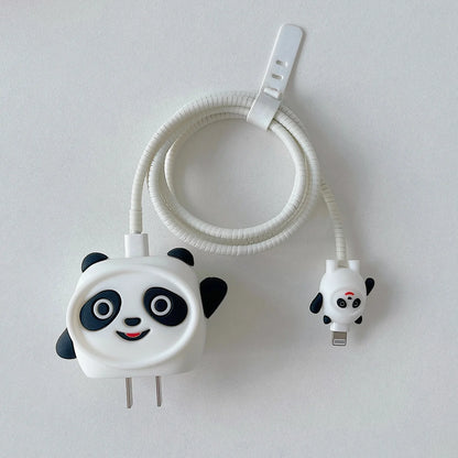 3D panda face charger cover with white spiral cable wrap and mini panda cable protector flat lay