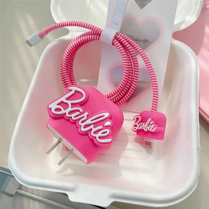 Hot pink silicone charger adapter cover and cable protector set in white tray