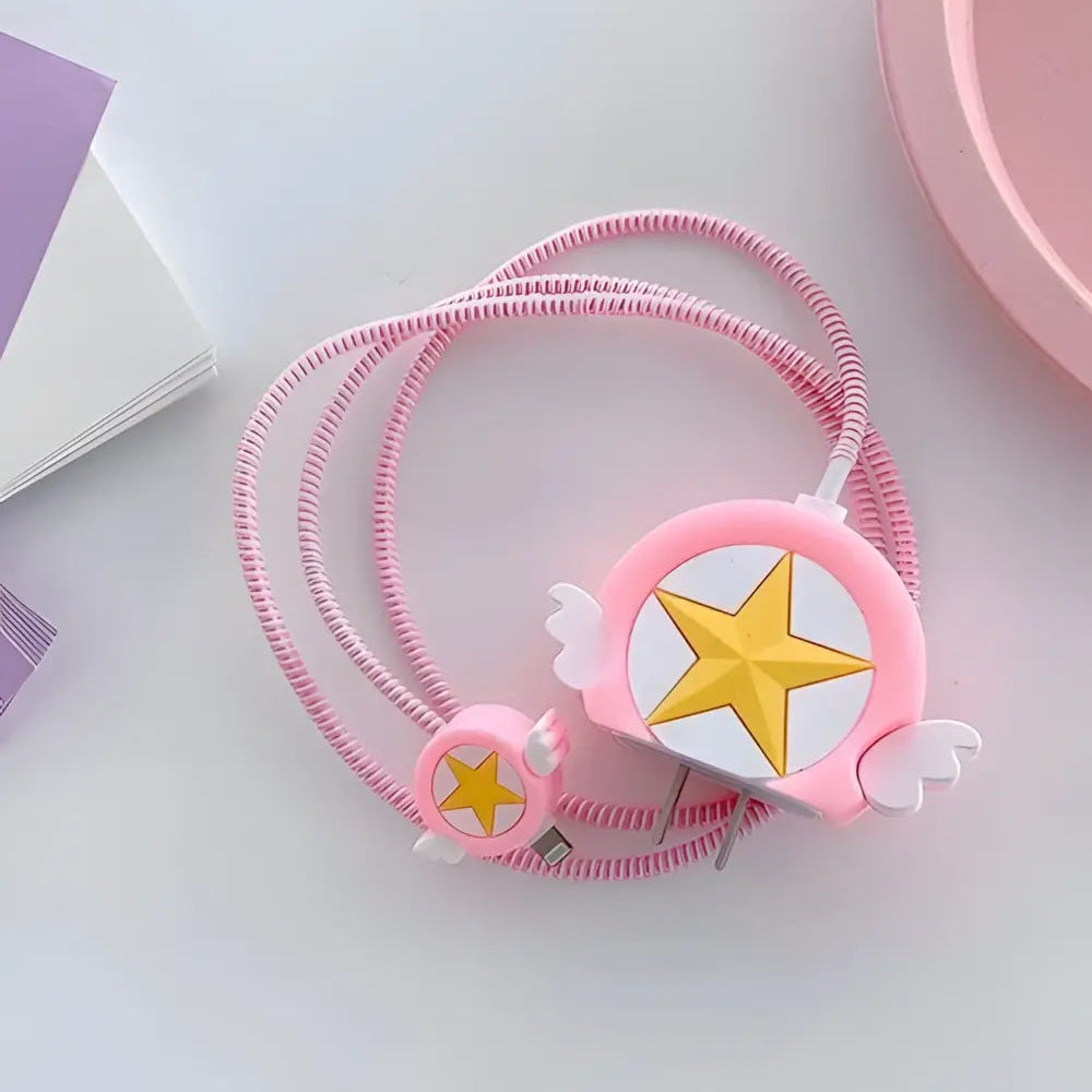Pink winged star charger cover and mini cable protector with pink spiral cable wrap on grey surface showing all components