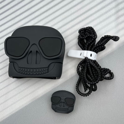 Hand holding skull AirPods case showing size and detail with cable protector