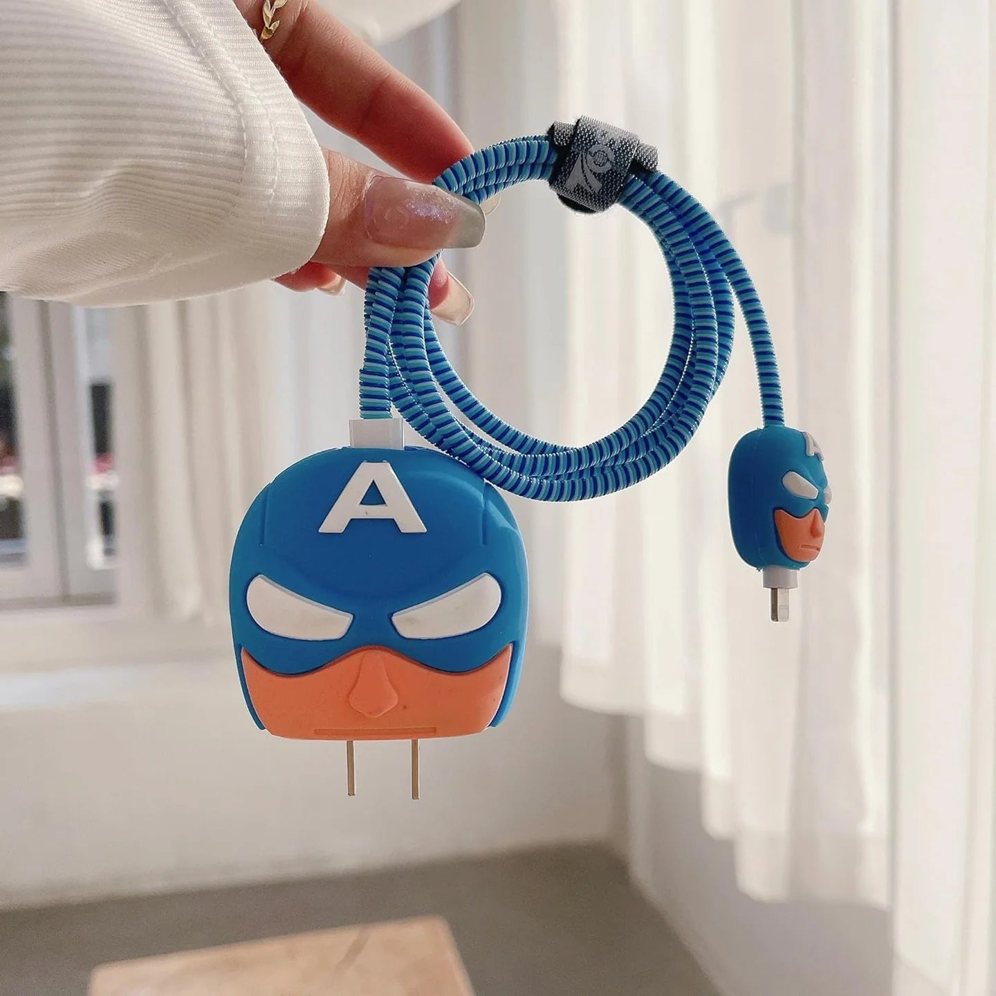 Blue hero mask charger cover on power strip