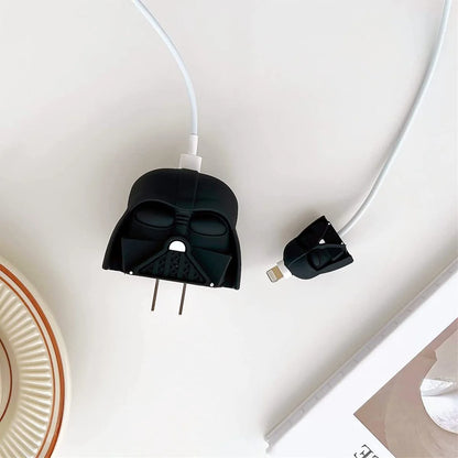 Matte black dark space villain helmet charger cover plugged into wall socket with white cable and mini helmet cable protector