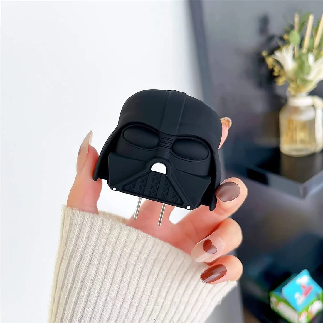 Matte black dark space villain helmet charger cover held in hand showing front detail