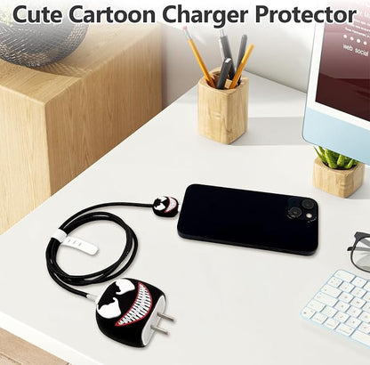 Venom charger adapter cover, mini cable protector and black spiral cable winder flat lay on grey surface