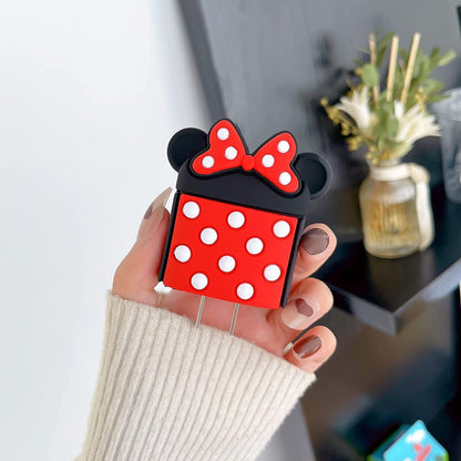 Bow mouse red and black silicone charger adapter cover held in hand showing polka dot body and bow detail