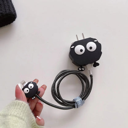 Black fluffy spirit charger cover and mini spirit cable protector with black spiral cable wrap held in hand