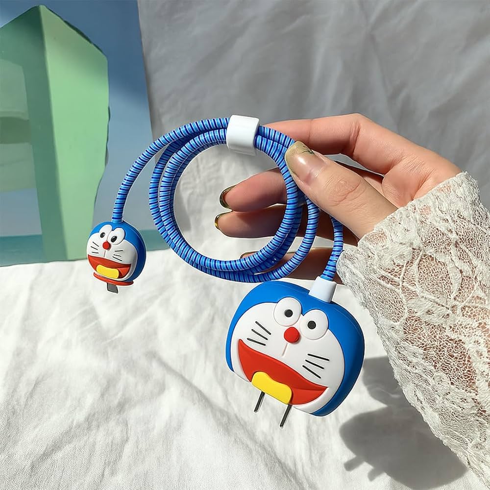 Blue kawaii cat face charger cover and cable protector held in hand