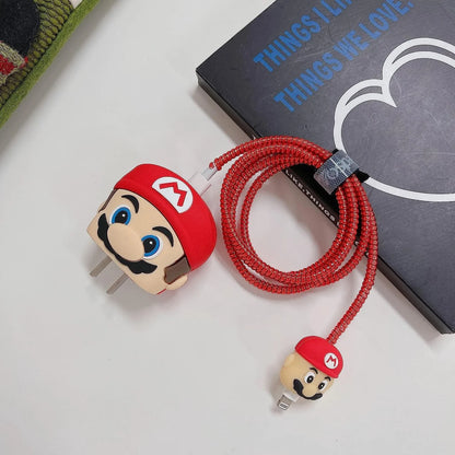 Yellow cartoon character charger cover and cable protector set on gift box with Christmas decor
