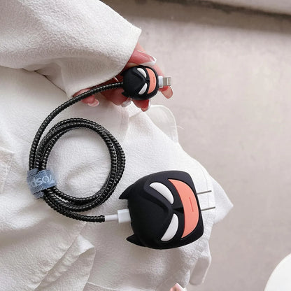 Dark masked hero charger cover and mini cable protector with black spiral cable wrap on white fabric