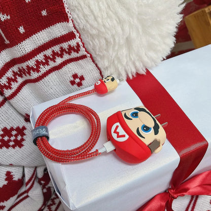 Yellow cartoon character charger cover and cable protector set on white surface with Christmas hat