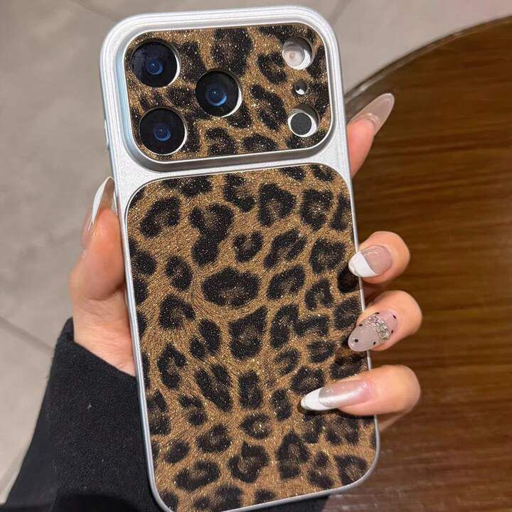 Phone case with leopard print held by a person