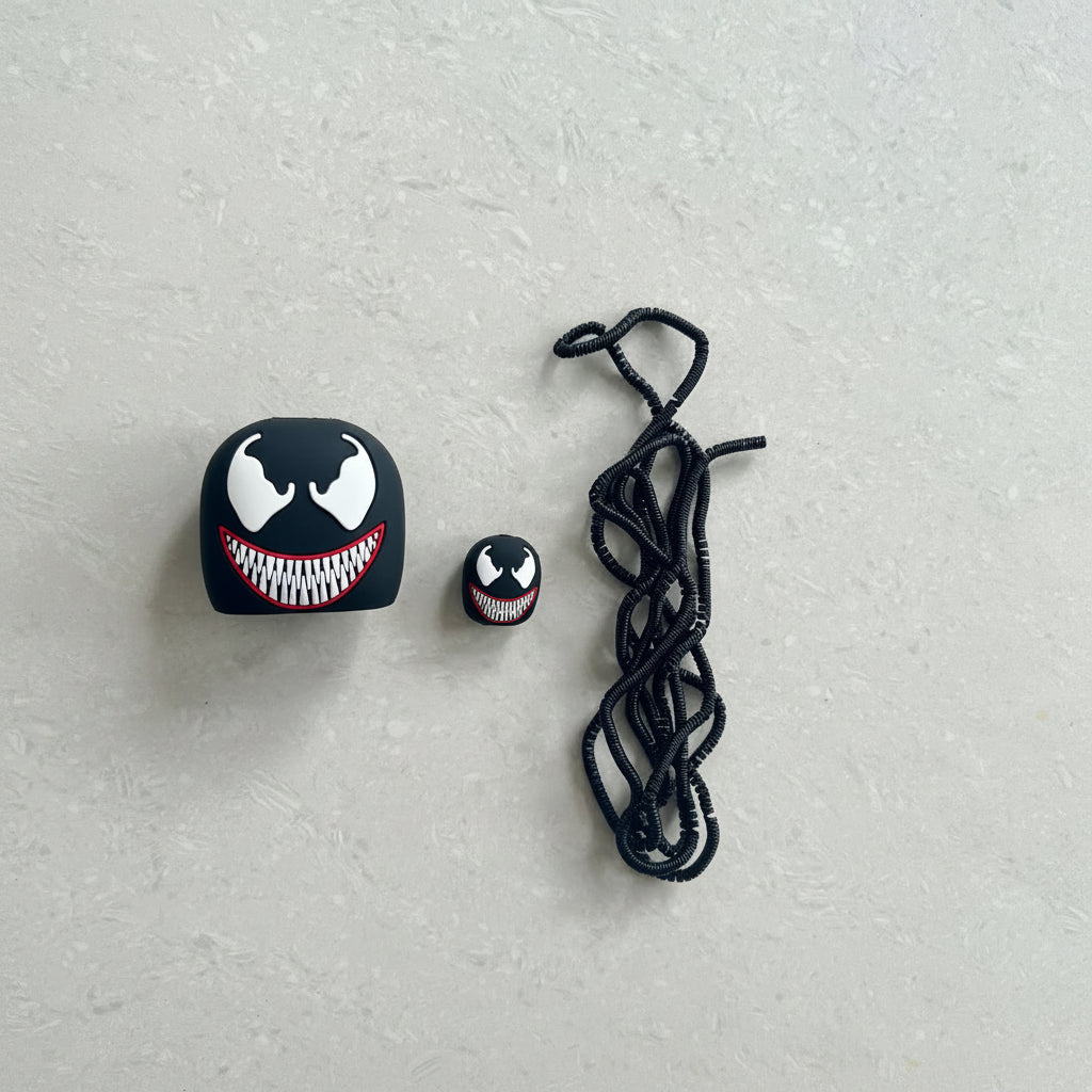 Venom silicone charger cover set with cable protector and black coil winder on white background