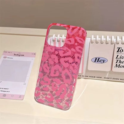 Model holding hot pink leopard glitter iPhone case with gold rings