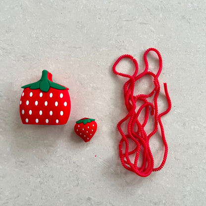Strawberry Charger Cover Mini Cable Bite and Red Coil Winder flat lay – iPouch