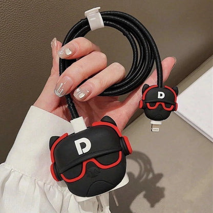 Black and red DJ character charger cover and cable protector set flat lay on white surface