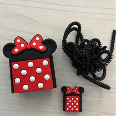 Bow mouse charger cover and mini cable protector with black coil winder flat lay on marble surface