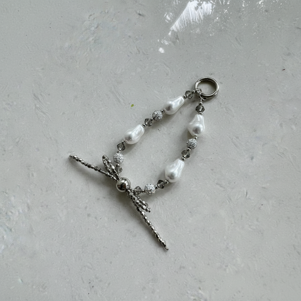 Baroque Pearl Dragonfly Charm - 45 Degree Marble Surface Shot