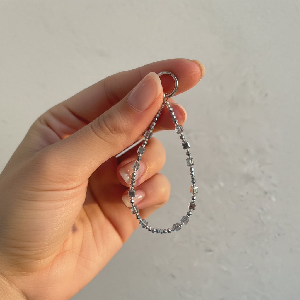 Silver Beaded Phone Charm - Golden Hour Hand Lifestyle Shot