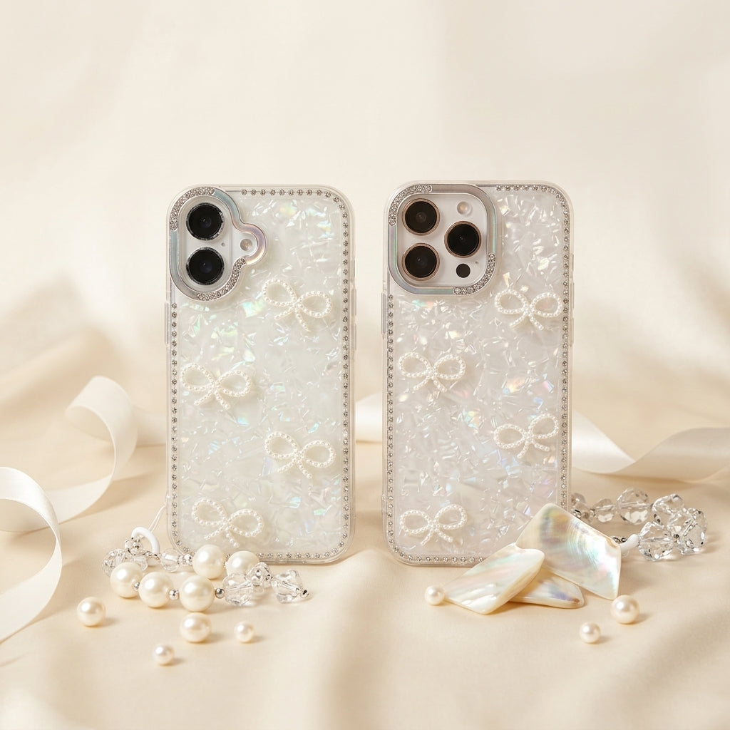 iPouch Pearl Shell Bow iPhone Case flat lay on marble with ribbon — opalescent holographic shell and rhinestone border