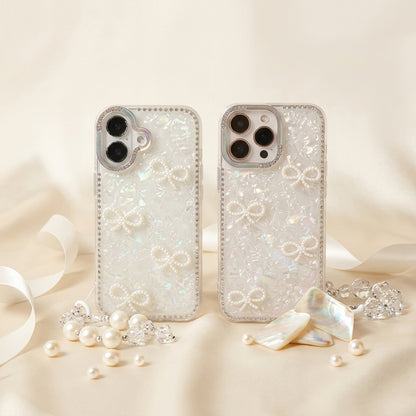 iPouch Pearl Shell Bow iPhone Case flat lay on marble with ribbon — opalescent holographic shell and rhinestone border